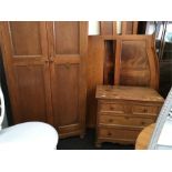 A Collette and Sons Meymont oak hanging wardrobe of panelled form and a similar three drawer chest.
