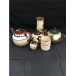 A set of Devon Ware teapots.