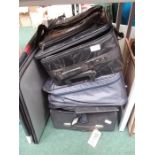 Various suitcases and holdall.