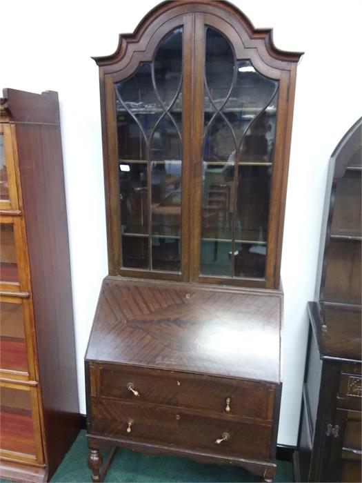 A bureau bookcase with two drawers under.