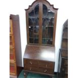 A bureau bookcase with two drawers under.