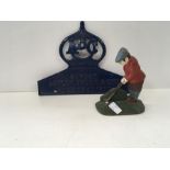 A cast metal door stop depicting a golfer together with an aluminium sign depicting ABC Astley,