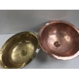 A copper sink and a brass sink.