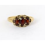 A 9 carat gold ladies' garnet ring, size P.