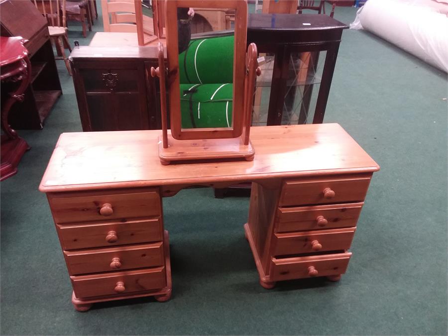 A pine two pier dressing table with a vanity mirror.