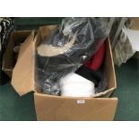 A large box containing fancy dress hats.