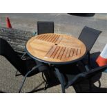 An aluminium garden table and four chairs.