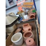 Four boxes of various terracotta plant pots.