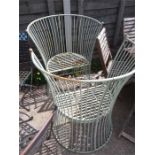 Two metal worked high back garden chairs.