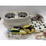 Assorted grooming and feeding paraphernalia for pet dogs.