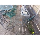 A metal garden bistro set of table and two chairs.