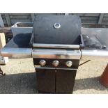 A large gas fired BBQ with side burner by Jamie Oliver.