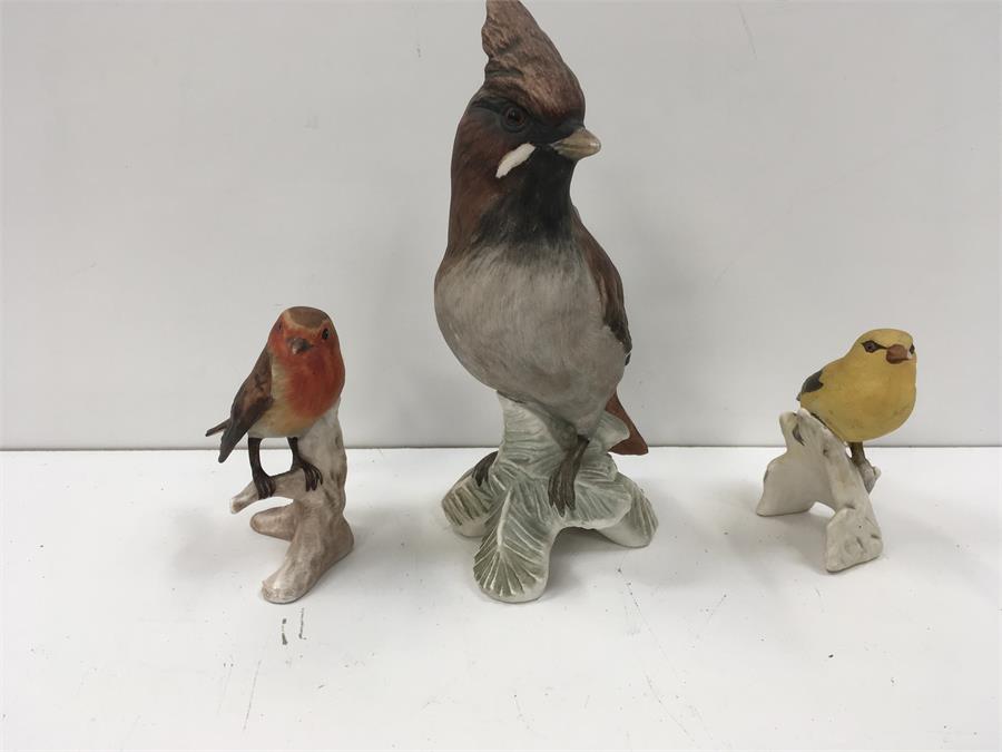 Three Goebel bird ornaments.