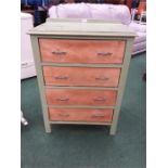 A green painted chest of four drawers.