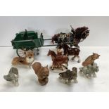 Ornaments to include dogs, elephants, Purbeck fox and squirrel together with a Shire horse and cart.