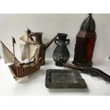 A wooden ship ornamental gun together with brass items, a lamp, vase jug and an ashtray.