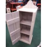 A white painted vintage two shelved cupboard.