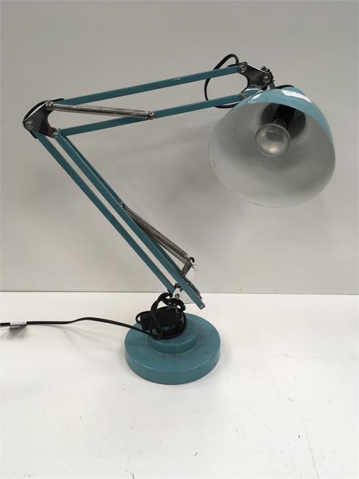 A blue angle poise lamp.