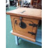 A wooden storage box with a central lock plate.