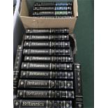 Three boxes of Encyclopaedia Britannica.