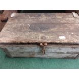 A wooden storage box with a rat trap.