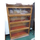 A haberdashery shop cabinet with up and slide doors.