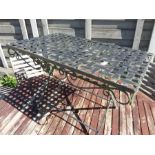 A metal lattice topped garden table.