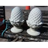 A pair of acorn finials.