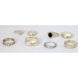 A collection of mixed silver rings.