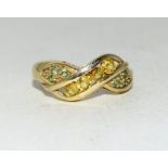 A 9 carat gold ladies' multi stone crossover ring, size N.