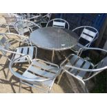 An aluminium garden table and six chairs.