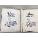 Two albums of Disney World of postage stamps.