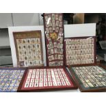 Various glazed picture frames containing cigarette cards.