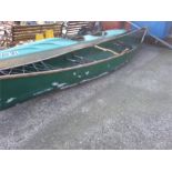 A fibreglass hull double Canadian canoe.