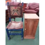 An oak pot cupboard together with a leather worked chair.