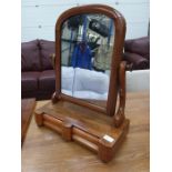 A mahogany vanity mirror with two trinket drawers.