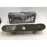 A boxed M.Tech Gyro Flyer together with a skate board.