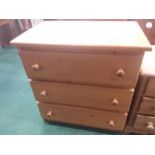 A modern pine three drawer chest.