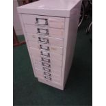 A ten drawer metal cabinet.