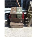 A quantity of ammo boxes and a grave diggers shovel.