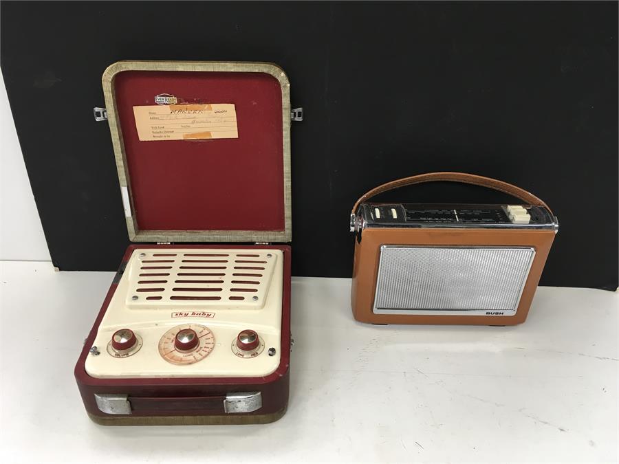 A Sky Baby portable radio together with a boxed Bush radio.