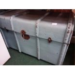 A large blue painted wood bound travel chest.