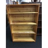 A modern pine bookcase with four shelves (33" wide x 4' high).