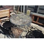 A garden bistro set of table and two chairs.