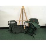 An easel together with artist seats and bag.