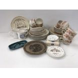Poole pottery items to include the residue of a Summer Glory tea/dinner service, commemorative mugs,