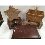 Wicker baskets, hampers and a small suitcase.