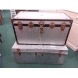 Two large galvanised travel trunks.