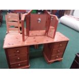 A large twin pier dressing table in pine together with a triple vanity mirror.