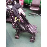 A Cosatto child's pushchair with covers.